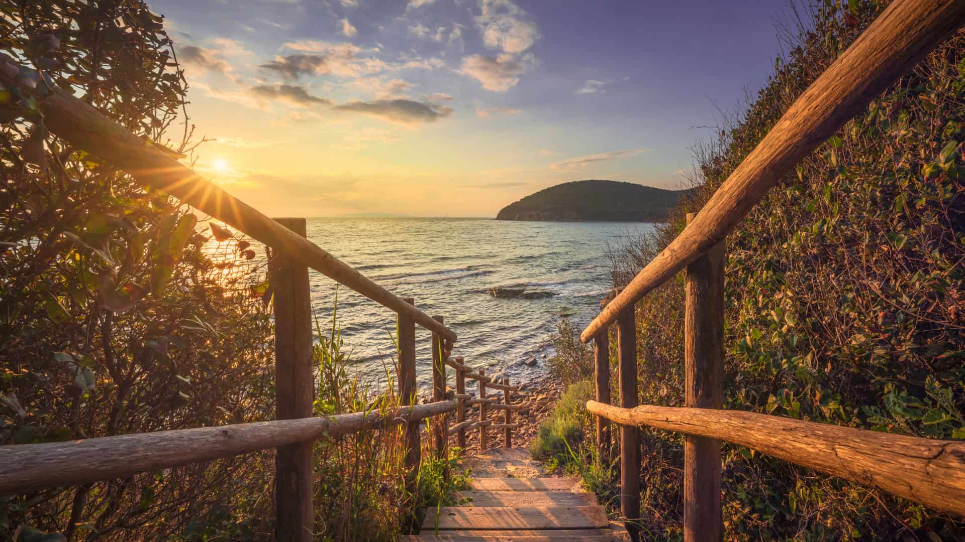 Wooden walkway leading to Cala Violina beach